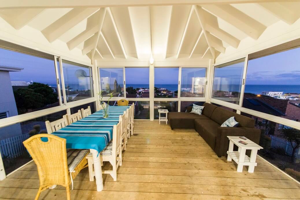 Enclosed-outdoor deck area with sea views